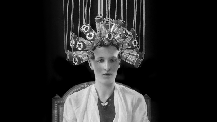  Woman modeling a hairstyle for the hairdresser Eugéne Ltd, 1923. © Museum of London.